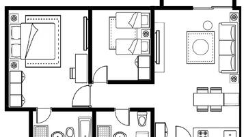 Ein Grundriss eines Hotels mit zwei Schlafzimmern, einem Badezimmer, einer Küche und einem Essbereich.