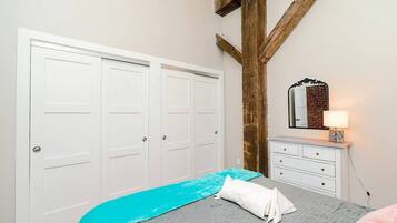 1 bedroom, desk, iron/ironing board, travel crib