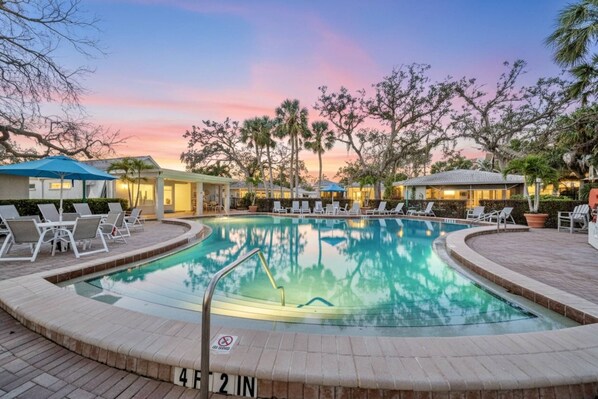 A heated pool, sun loungers