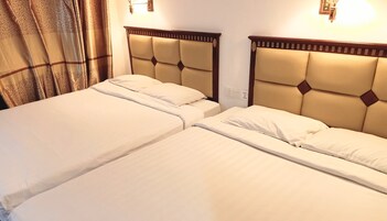 Family Room, 2 Double Beds | Free WiFi, bed sheets