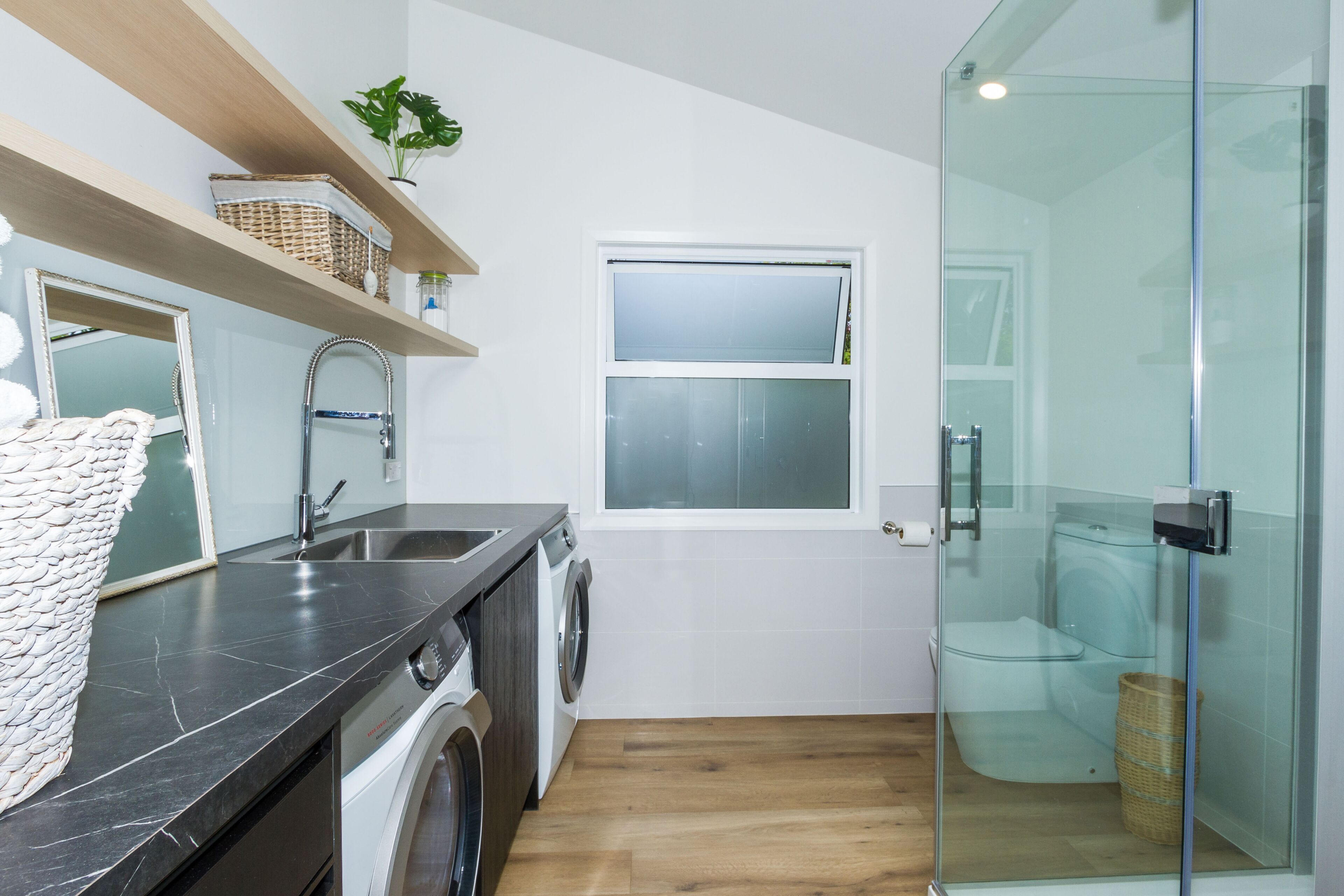 Bathtub, hair dryer, towels, toilet paper