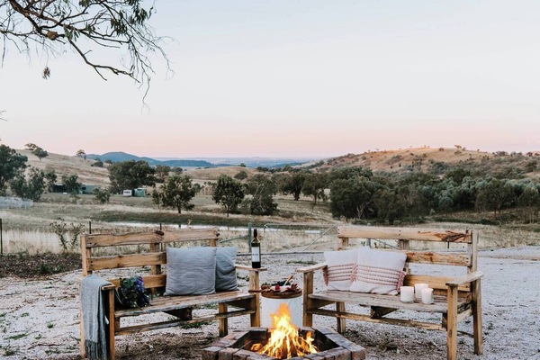 Cosy around the fire pit come evening and enjoy views of the sun setting over rolling hills.