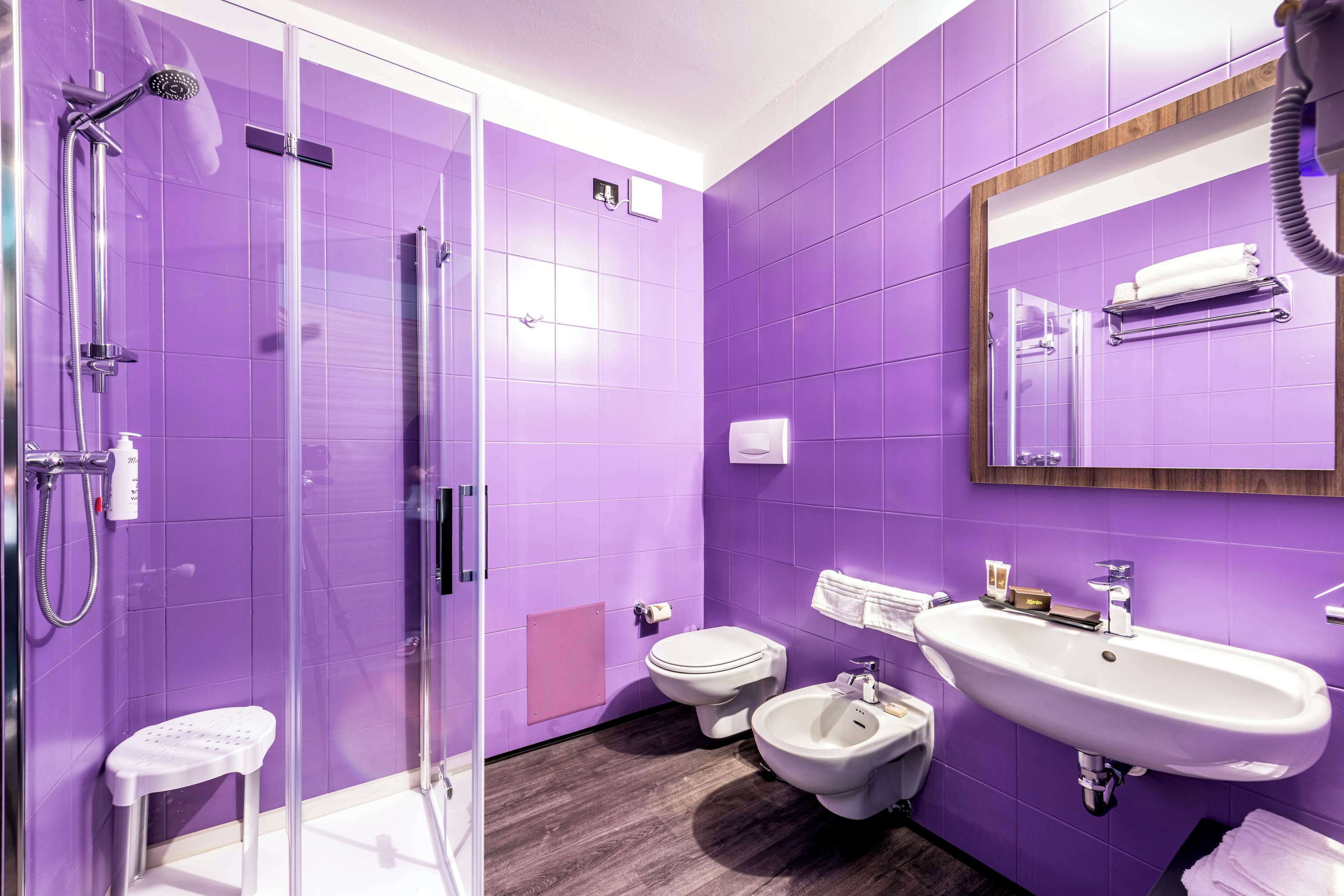 comfort room, 1 queen bed, mobility accessible | bathroom | rainfall showerhead, free toiletries, hair dryer, bidet