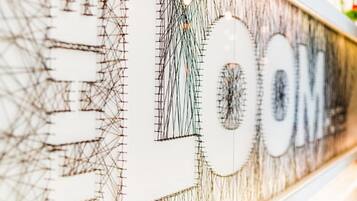 A close-up of a wall with a complex, abstract design featuring geometric shapes and lines.