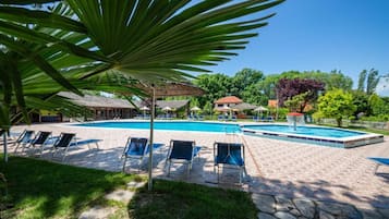 Indoor pool, seasonal outdoor pool, pool umbrellas, pool loungers