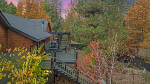 A wooden cabin with a covered porch and a staircase leading to a deck. - Family Retreat: Near Town, Hot Tub, AC, (Idyllwild)