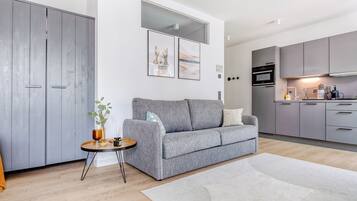 Suite XL with Sofa Bed | Living area | 50-inch Smart TV with satellite channels, TV