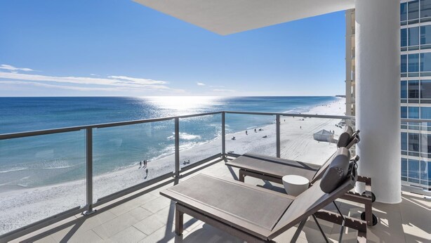 A balcony with a view of the beach and ocean. - Ocean Front with Rooftop Pool Access (Destin)