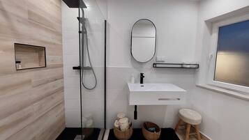 Shower, hair dryer, towels, soap