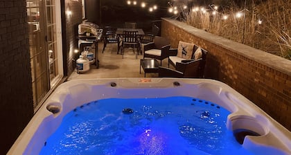 The Peaceful cabin in the woods with a Hot tub, firepit, and game room!!