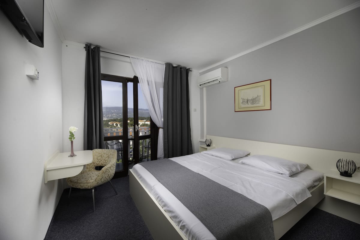 Standard Double Room | Minibar, laptop workspace, blackout drapes, free WiFi