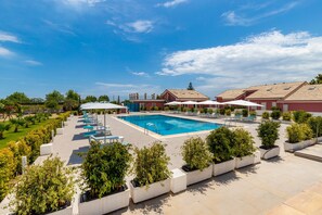 Outdoor pool, open 9:00 AM to 6:00 PM, pool umbrellas, pool loungers