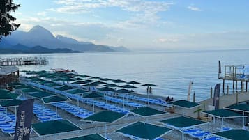 Private beach nearby, black sand, free beach cabanas, sun loungers