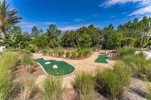 Play a round amidst lush greenery and trees on this scenic miniature golf course.