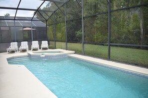 A heated pool, sun loungers