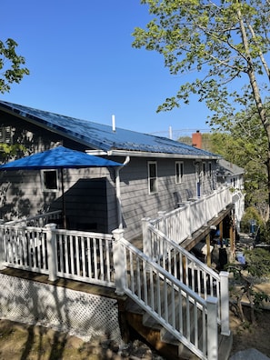 Enjoy the tranquil atmosphere and expansive deck with a fireplace and outdoor space.