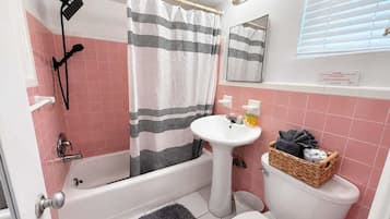 Bathtub, hair dryer, towels