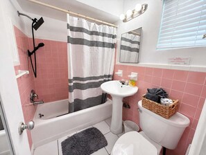 Bathtub, hair dryer, towels
