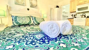 1 bedroom, desk, iron/ironing board, travel crib