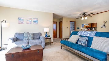Deluxe Condo | Living area | Flat-screen TV, streaming services