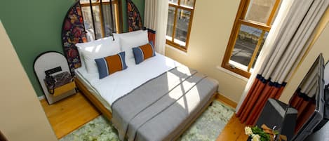 Deluxe Family Suite | Italiaanse Frette-lakens, luxe beddengoed, een minibar