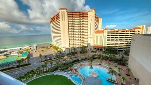A hotel with a large pool, a beach view, and multiple buildings. - Aqua Penthouse 2br/2ba with Infinite Ocean Views (Panama City Beach)