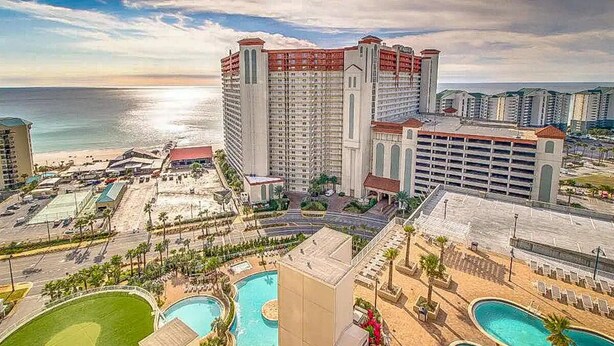A resort with multiple swimming pools, a large hotel building, and a beach view. - Aqua Penthouse 2br/2ba with Infinite Ocean Views (Panama City Beach)