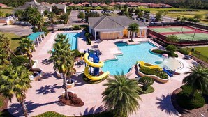 A resort with multiple swimming pools, palm trees, and a tennis court. - Golf Hideaway With Lake View! Modern Decor and Game Room With Multiple Options! #5pr2197 (Davenport)