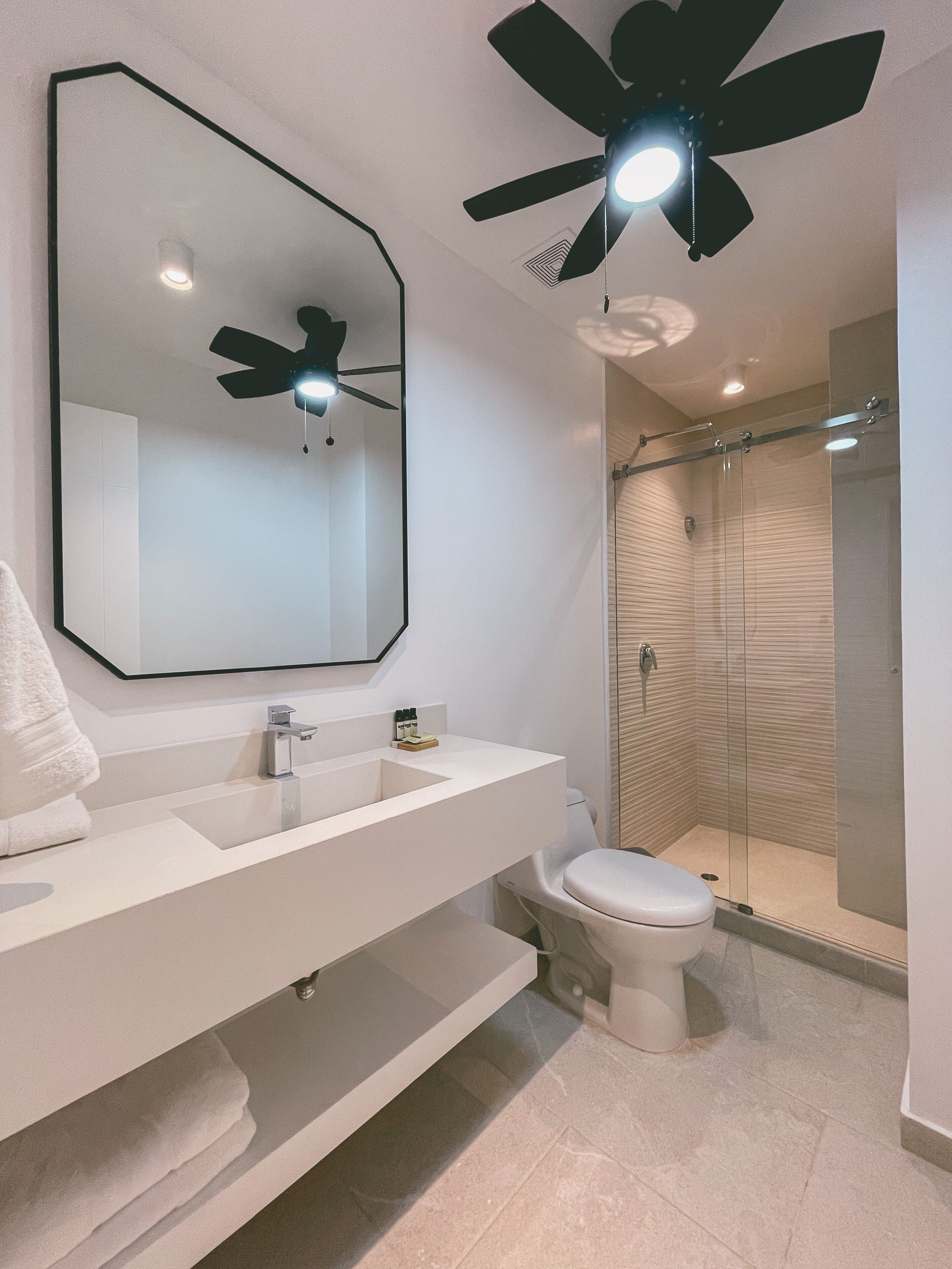 luxury room | bathroom | shower, rainfall showerhead, towels