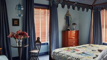 A bedroom with a four-poster bed, a dresser, a chair, a table with a vase of flowers, and a hanging lantern.