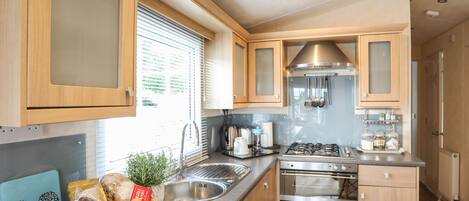 Fridge, electric kettle, toaster, cookware/dishes/utensils