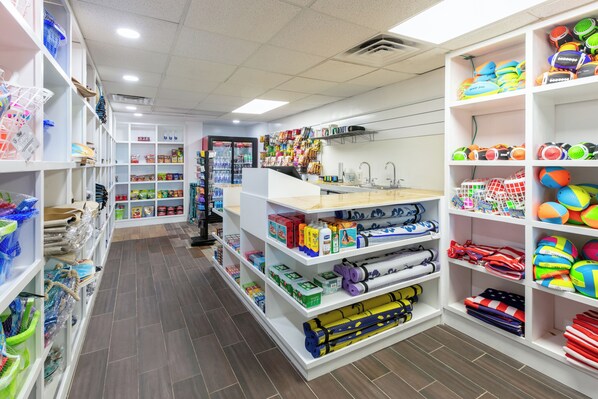 A brightly lit store with shelves stocked with various items including sports equipment, toys, and household goods. - Wyndham Corpus Christi Resort North Padre Island (Corpus Christi)