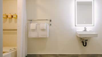 Designer toiletries, hair dryer, towels