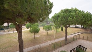 A park with several trees, a paved walkway, and a fenced area. - AS21600-P2Cabin 200m from the beach and parking (LE GRAU DU ROI)