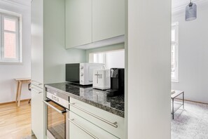 Fridge, microwave, oven, stovetop - Tasteful Werd 2.5 Room w/ Storage, by Blueground (Zurich)