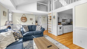 TV, fireplace, books - Turtle Cove Cottage: Steps to Long Pond Beach (South Yarmouth)