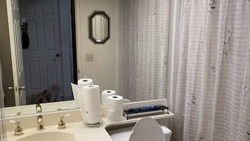 Combined shower/tub, towels, soap, toilet paper