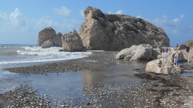 A rocky beach with large boulders and a clear sky. - 22C Christina Hilltop Apartment panoramic views. (Peyia)