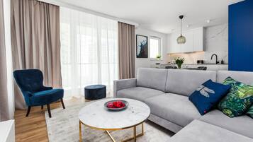 Superior Apartment | Living area | 55-inch Smart TV with cable channels, TV