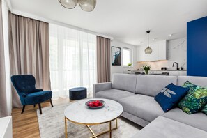 Superior Apartment | Living area | 55-inch Smart TV with cable channels, TV