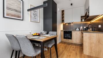 Panoramic Apartment | Private kitchen | Full-size fridge, microwave, oven, stovetop