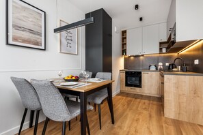 Panoramic Apartment | Private kitchen | Full-size fridge, microwave, oven, stovetop