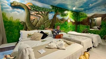 Premium Family Room | Minibar, in-room safe, individually decorated, desk