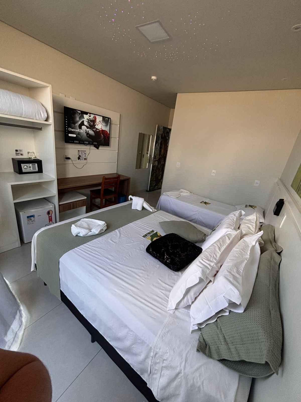 Standard Triple Room | Minibar, in-room safe, individually decorated, desk