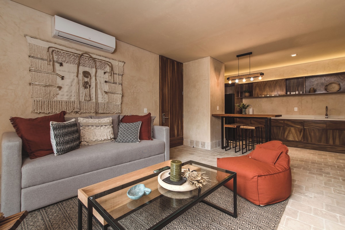 Deluxe Apartment, 1 Bedroom, Terrace | Living room | 50-inch Smart TV with digital channels, TV, books
