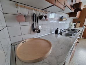 Microwave, dishwasher, coffee/tea maker, cookware/dishes/utensils