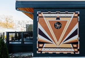 Stunning city landmark with a unique geometric mural and contemporary design.
