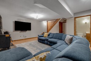 Smart TV, fireplace, table football, books