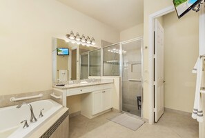 Combined shower/bathtub, hair dryer, towels, soap - Gorgeous 4 Bed / 3 Bath Gated, Resort Home in Marina Bay, Fort Myers (Fort Myers)