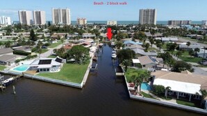 A residential area with a canal, houses, and a beach 2 blocks away. - Beachside Daytona Beach Shores 5 min walk to beach, restaurants and more! (Port Orange)